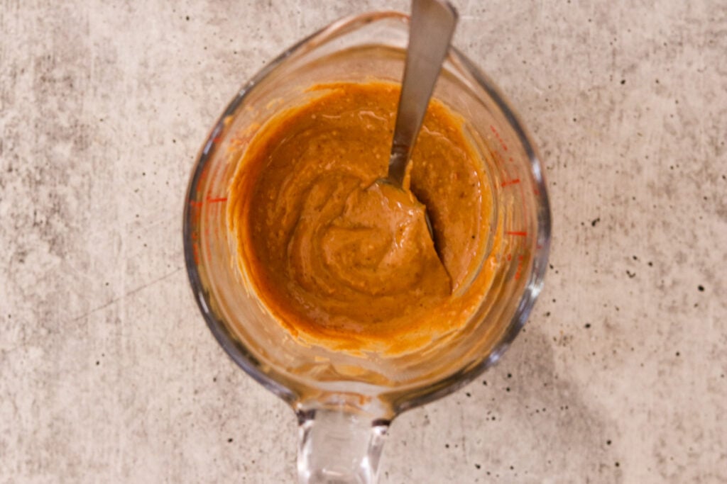 peanut butter metled in a measuring jar. 
