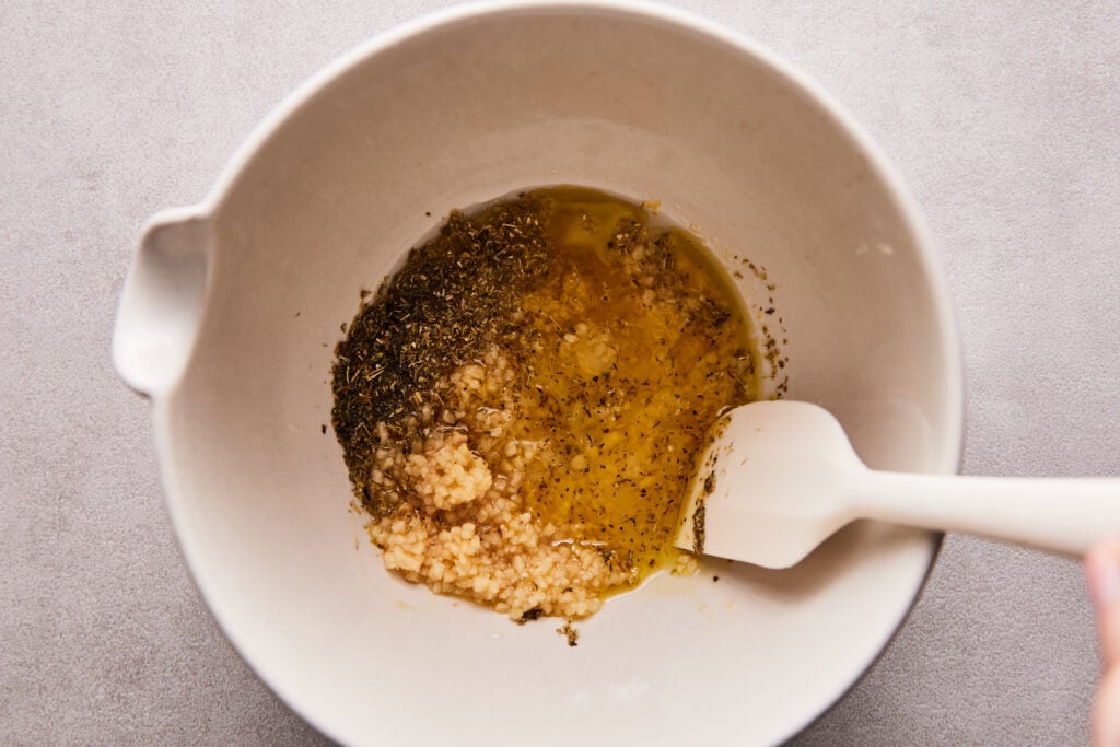 combining the lemon garlic marinade in a small mixing bowl