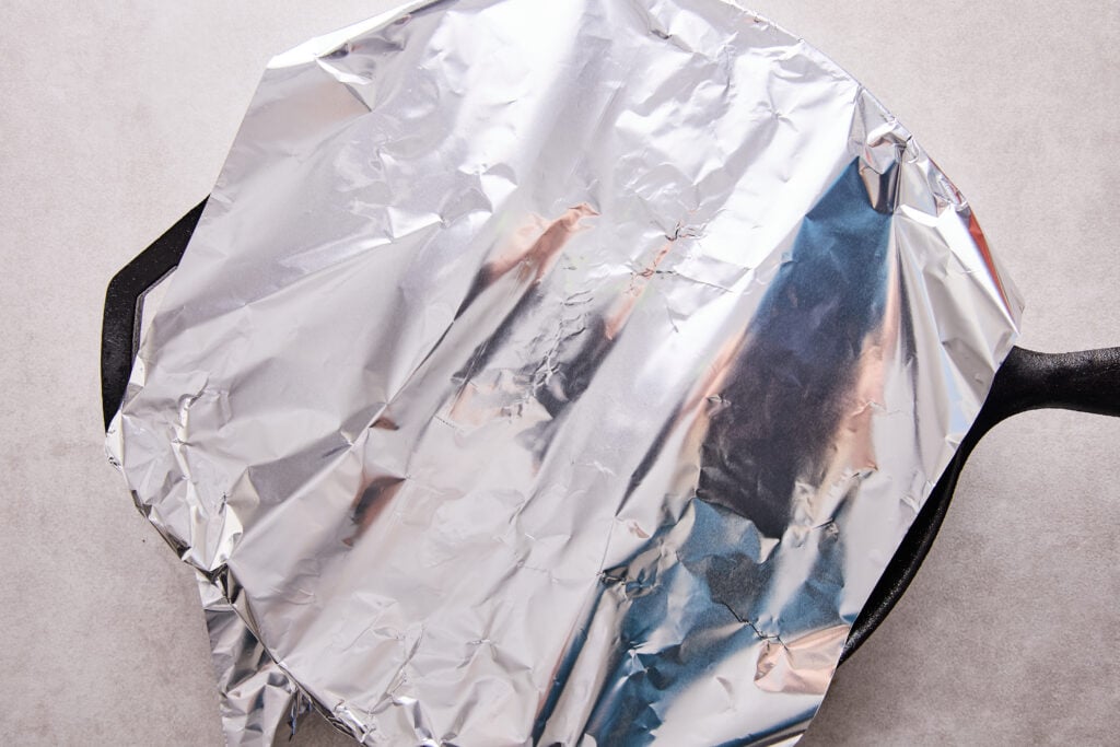 resting the lamb chops in foil to finish