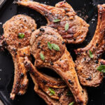 pan fried lamb chops in a cast iron skillet