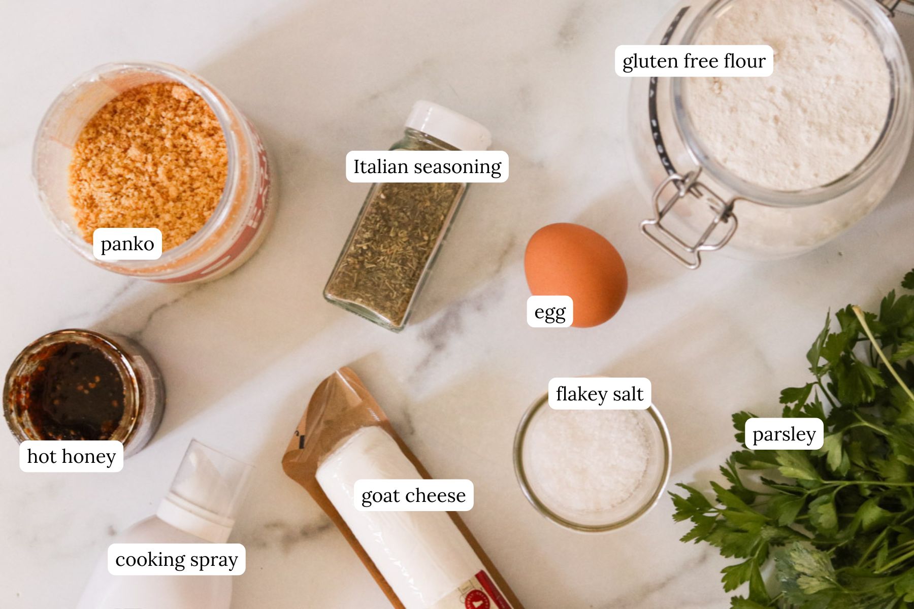 Recipe ingredients arranged in bowls on a white countertop.