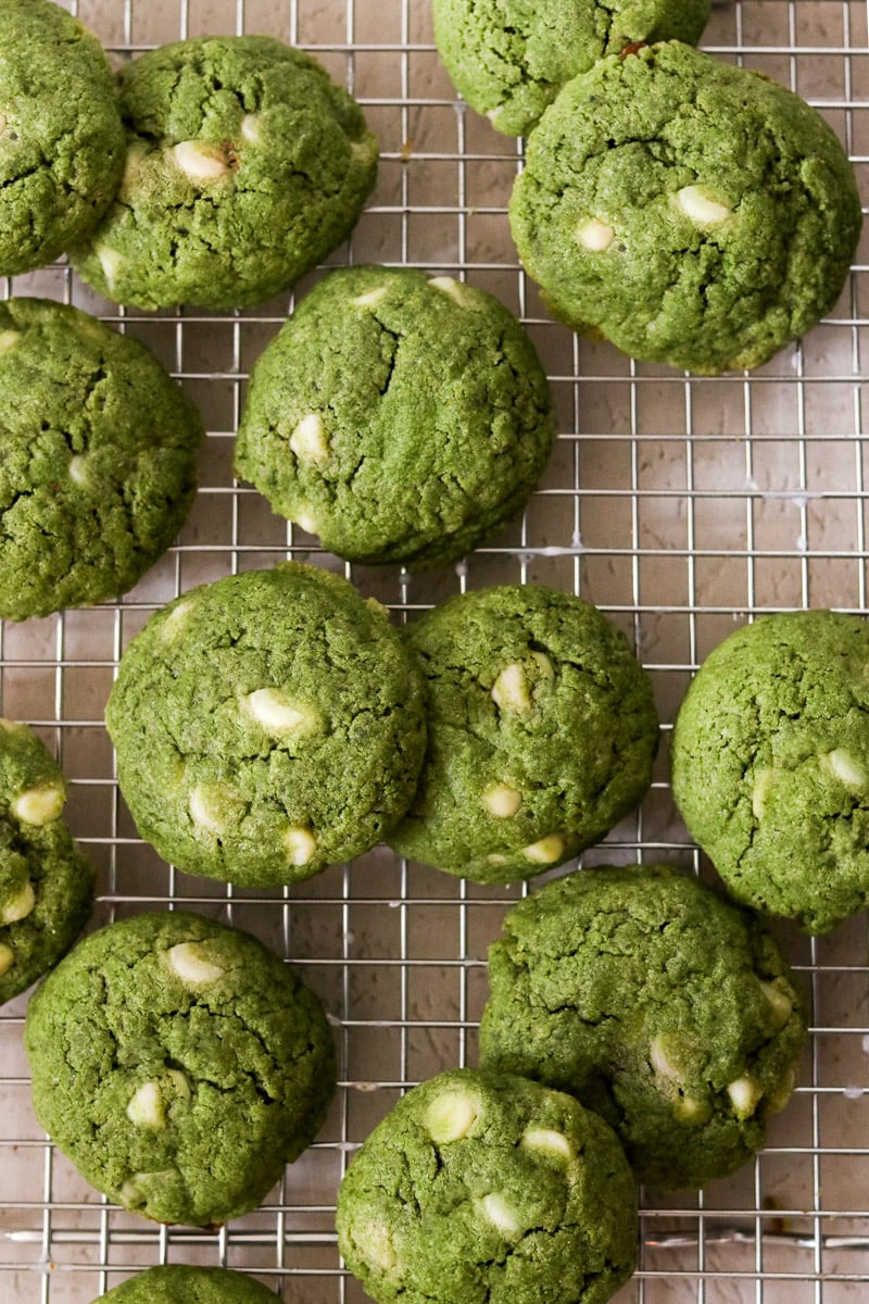 Matcha chocolate chip cookies on a cooling rack.