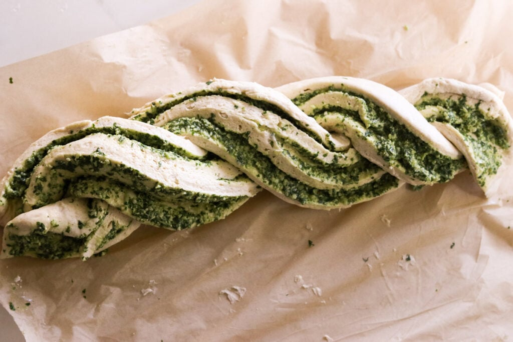 twisting the two pieces of dough into a braided look