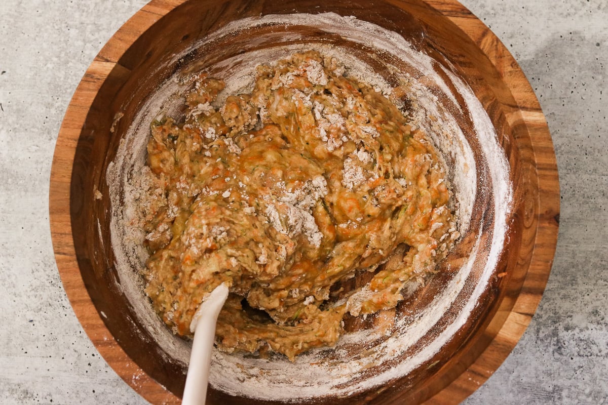 Dry ingredients being added to the wet ingredients.