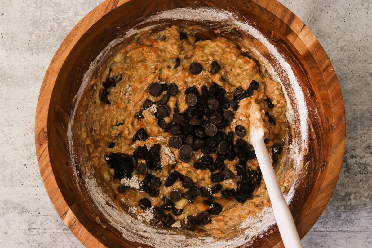 Chocolate chips and raisins being folded into the batter.