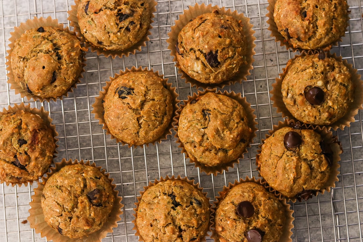 Gluten-free morning glory mufins on a wire cooling rack.