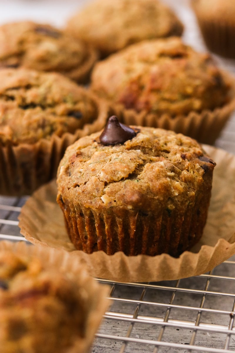 Gluten-free morning glory muffins on a wire cooling rack.