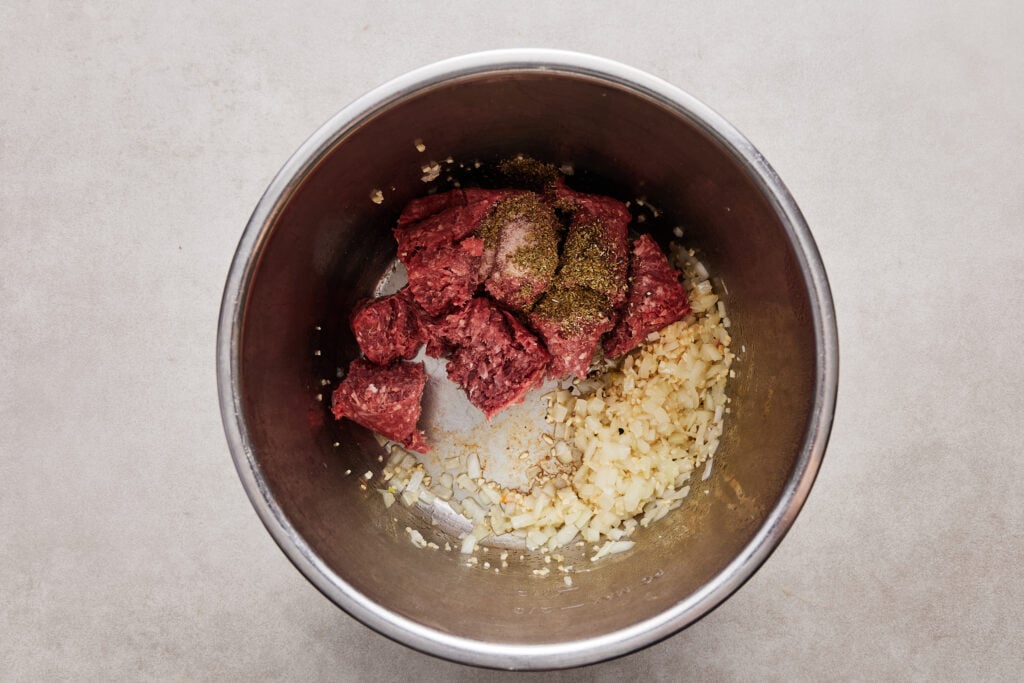 mixing in the ground beef to cook before adding the veggies