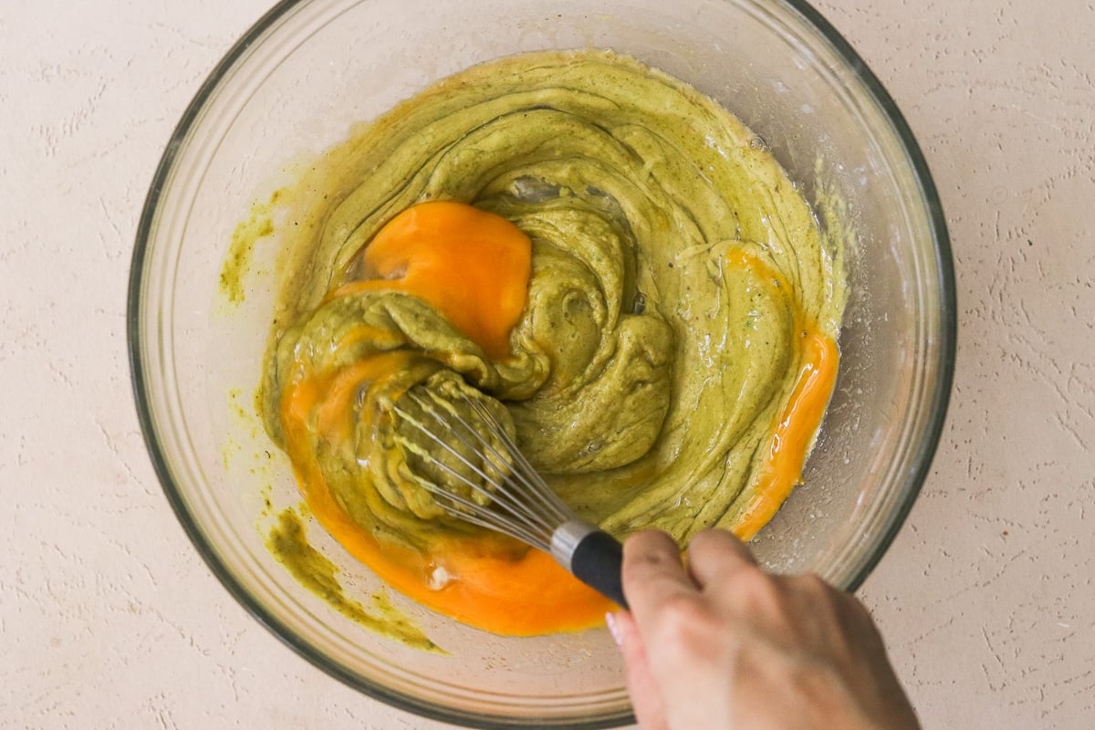 Eggs being whisked into pistachio blondie batter.