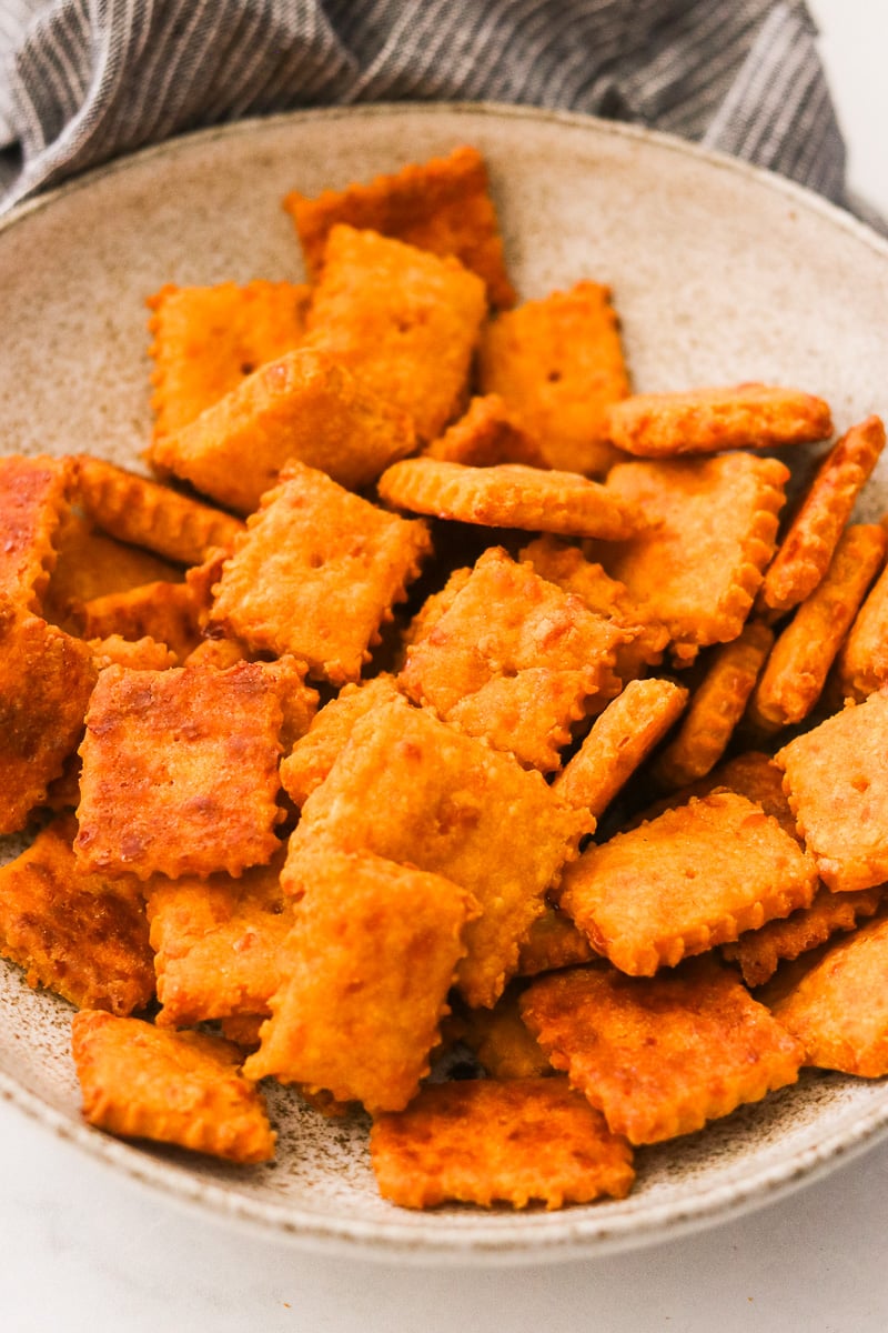 A bowl of crispy sweet potato crackers.