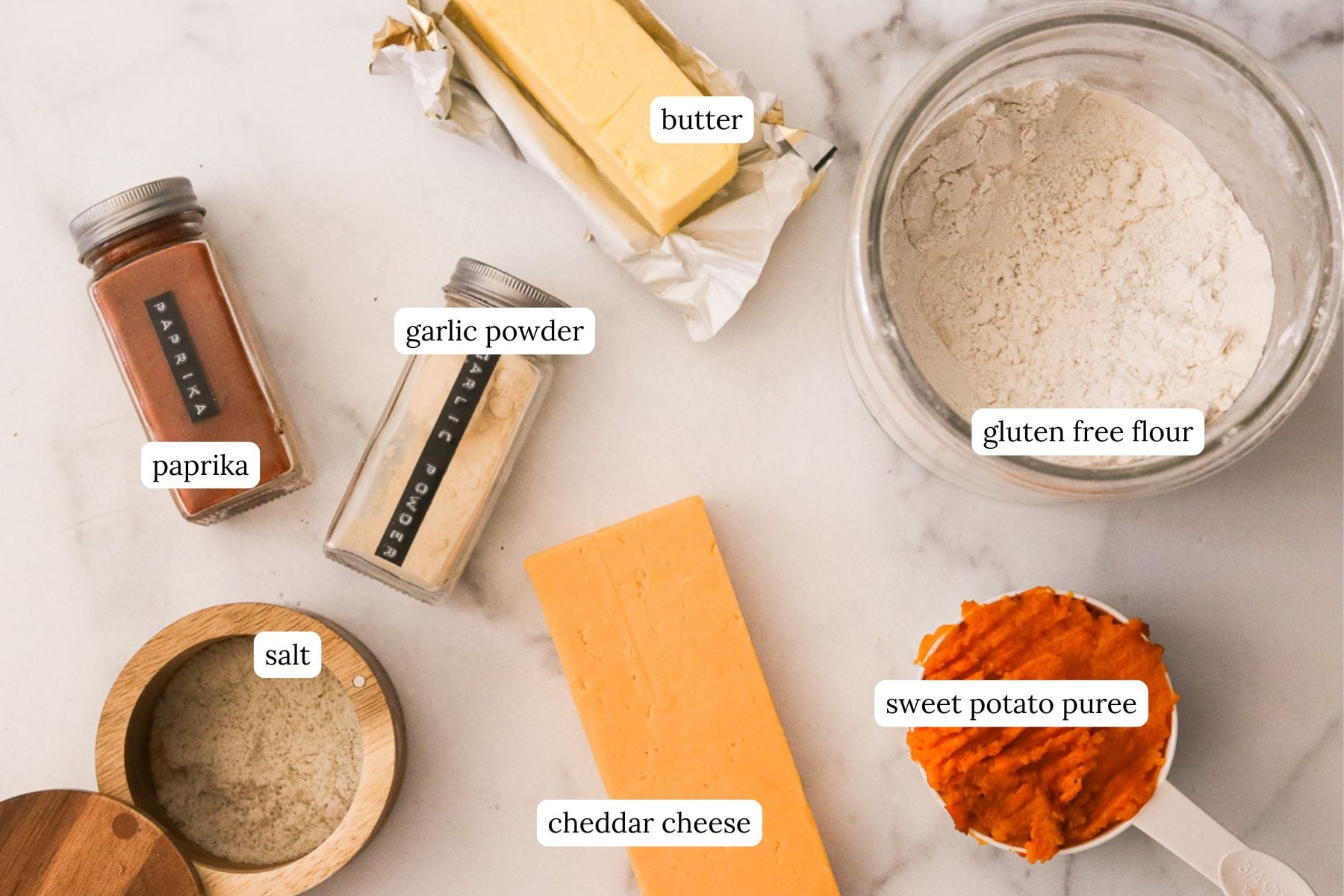 Sweet potato crackers recipe ingredients labeled and laid out on a countertop.
