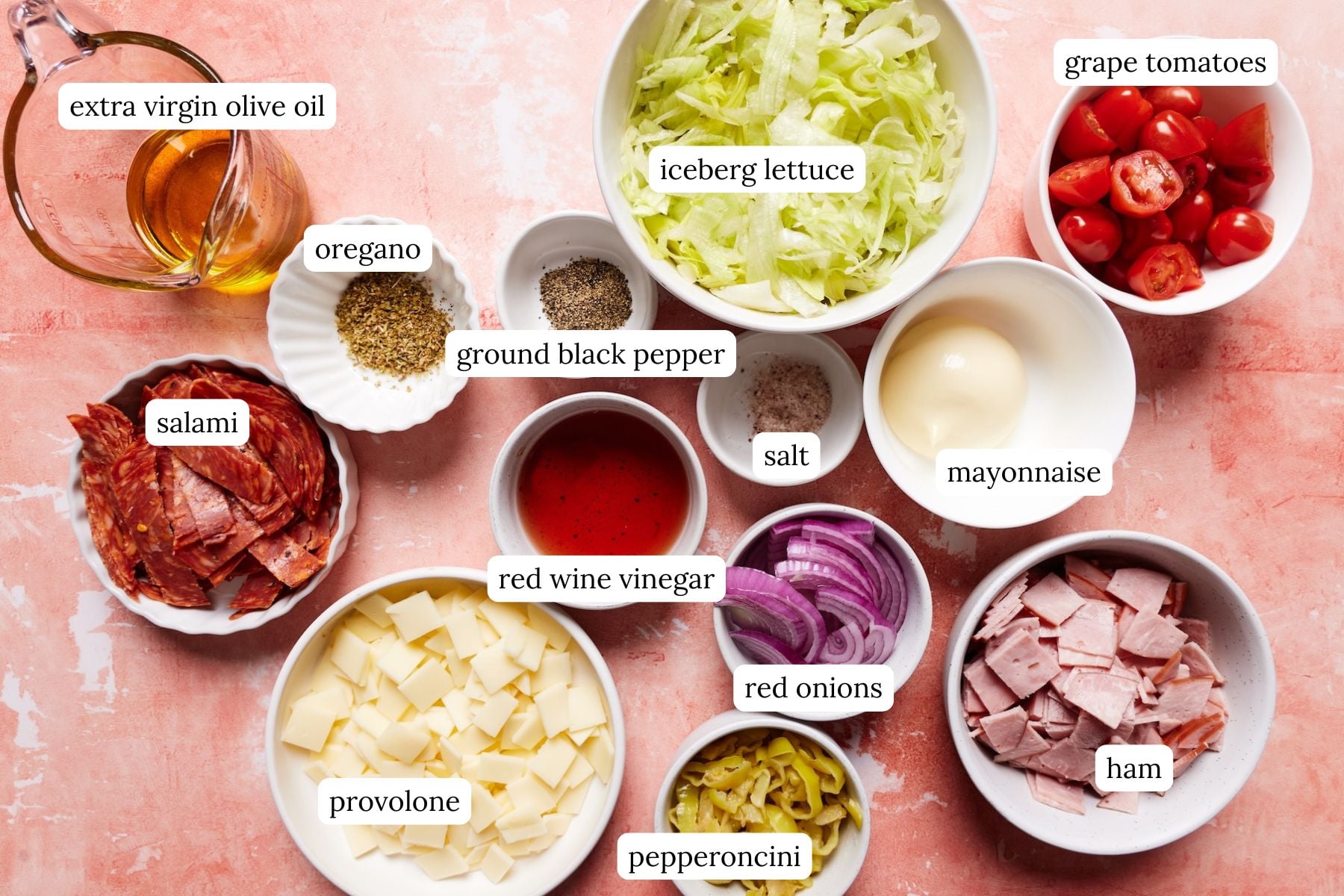 Sub in a tub recipe ingredients laid out in bowls and labeled.