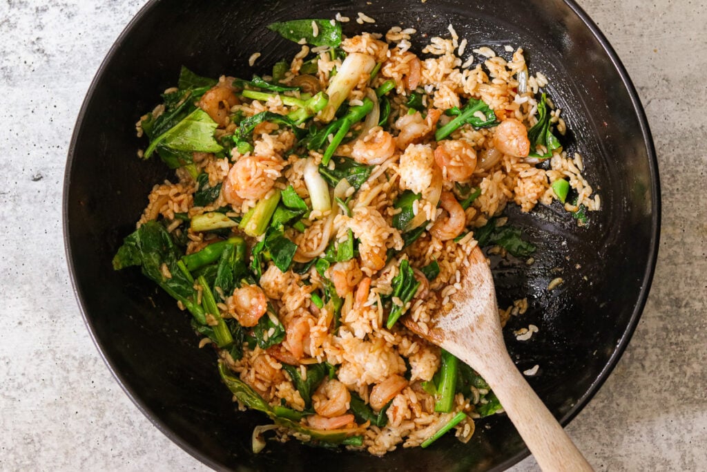 the rice and veggies sauteeing in the wok