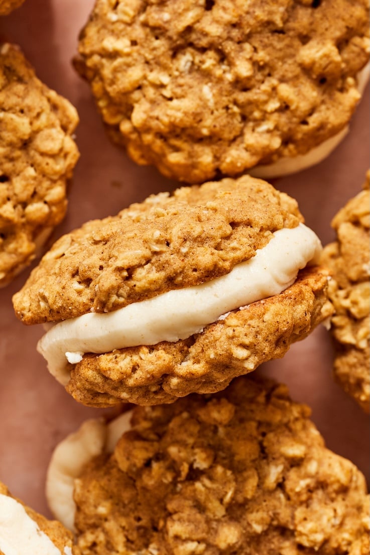 A close up of one oatmeal cream pie filled with brown butter cream.