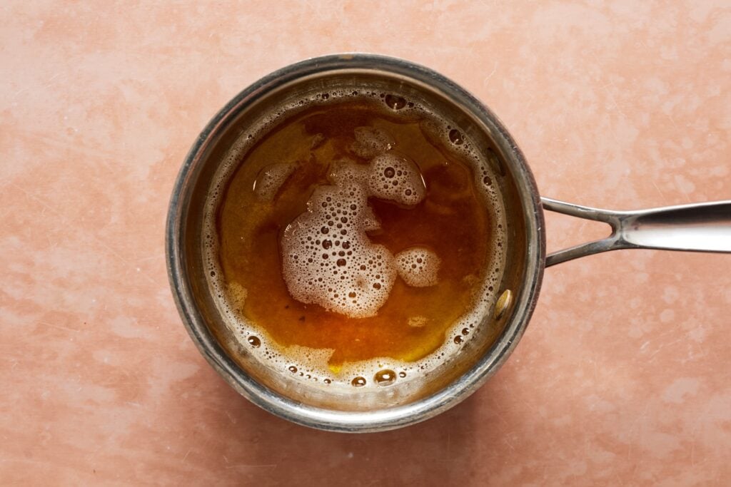 A saucepan with bubbling brown butter.