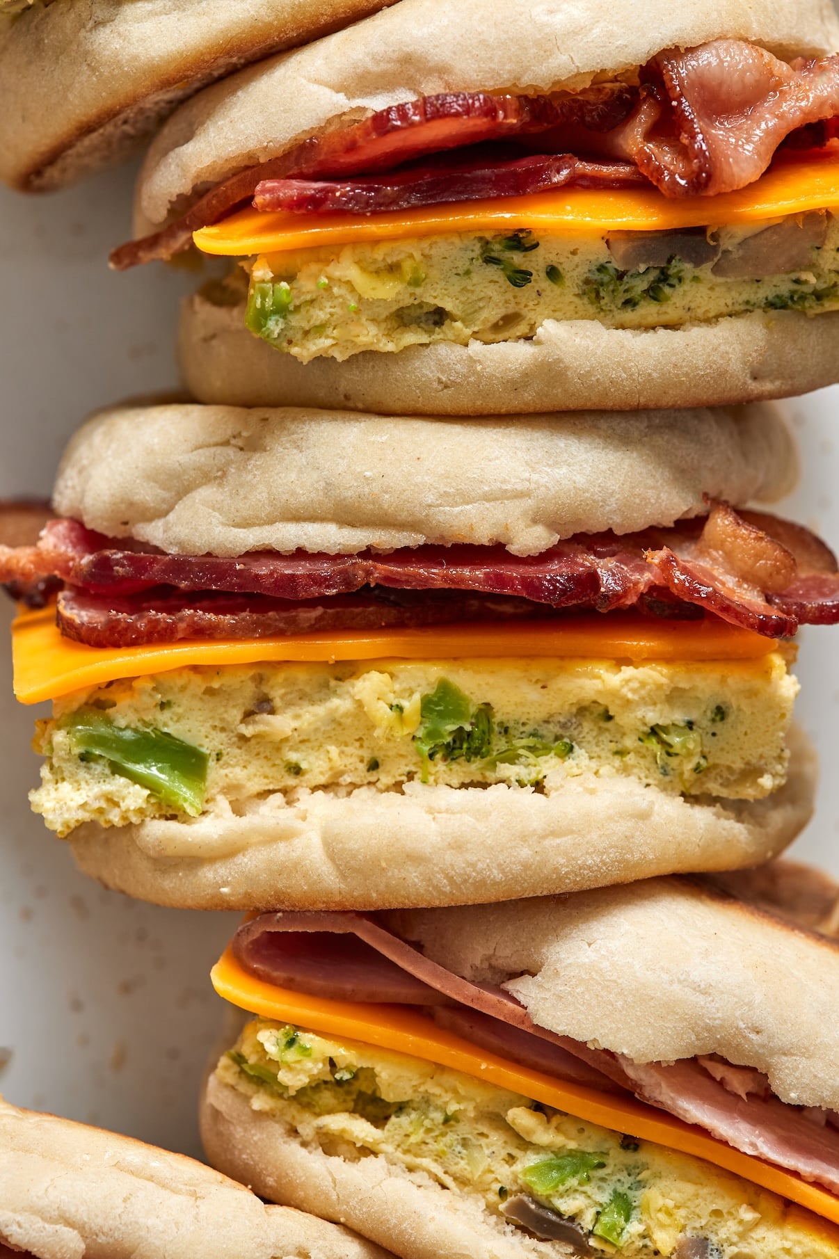 A close up shot of freezer breakfast sausages made with hidden veggie eggs, cheese, and either ham or bacon.